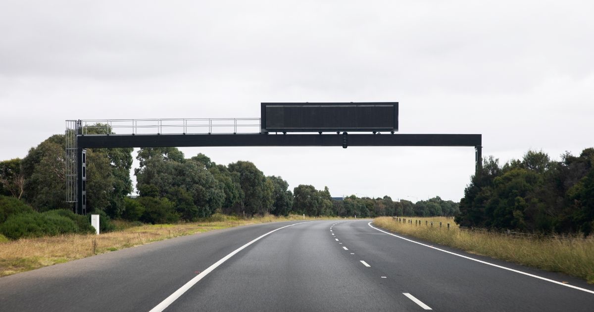 A stock photo shows a electronic highway sign with no message.