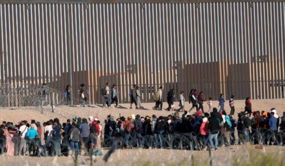 Illegal immigrants wait to be processed by the U.S. Border Patrol after having crossed the Rio Grande River from Ciudad Juarez, Mexico, on Dec. 5.