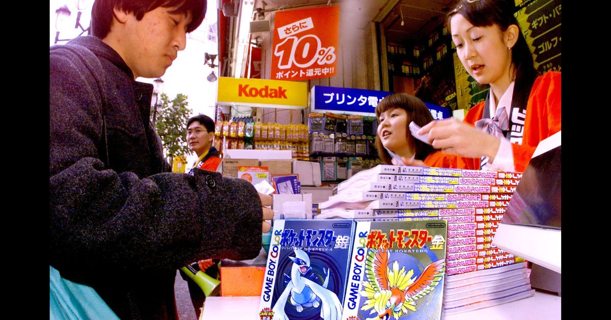 A Japanese customer purchasing a second generation Pokémon game.