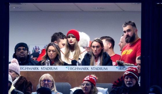 Jason Kelce, far right, and Taylor Swift, center, watch the Kansas City Chiefs play the Buffalo Bills in Orchard Park, New York, on Sunday.