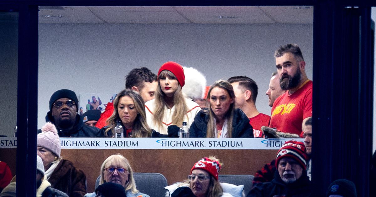Jason Kelce, far right, and Taylor Swift, center, watch the Kansas City Chiefs play the Buffalo Bills in Orchard Park, New York, on Sunday.