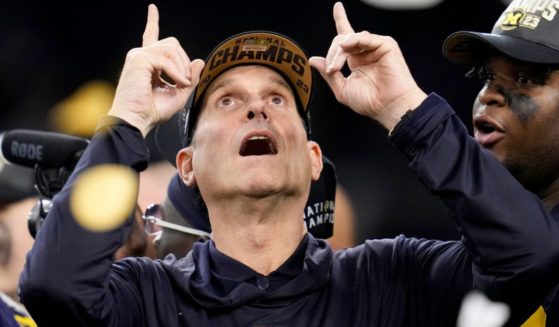 Michigan head coach Jim Harbaugh celebrates after winning the national championship NCAA college football playoff game, Jan. 8, in Houston.