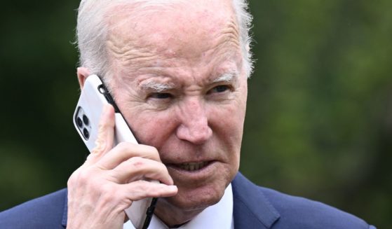 President Joe Biden speaks on the phone during a National Small Business Week event in the Rose Garden of the White House in Washington, D.C., on May 1.