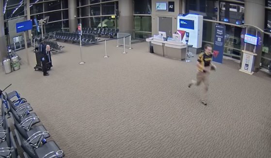 Kyler Efinger runs through Salt Lake City International Airport before his death.