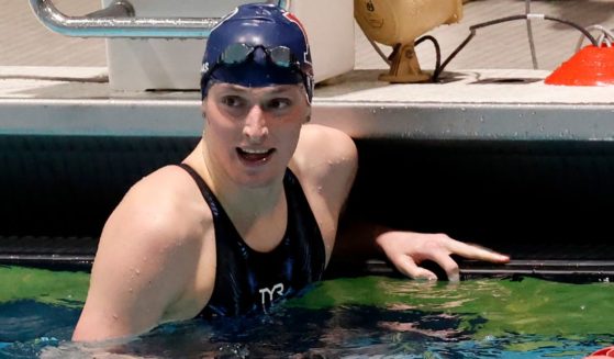 Transgender swimmer Lia Thomas smiles after winning the 100-yard freestyle final at the 2022 Ivy League Women's Swimming and Diving Championships while swimming for the Univesity of Pennsylvania women's team.