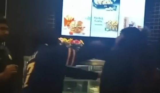 Two men got into a fight in a Truro, Nova Scotia, McDonald's after the man on the right began making a scene for not receiving Pokemon cards with the children's meals that he had ordered and the man in the middle stepped in.