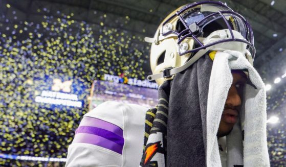 Washington Huskies quarterback Michael Penix Jr. walks off the field after being defeated by the Michigan Wolverines in the CFP National Championship Game in Houston, Texas, on Monday.