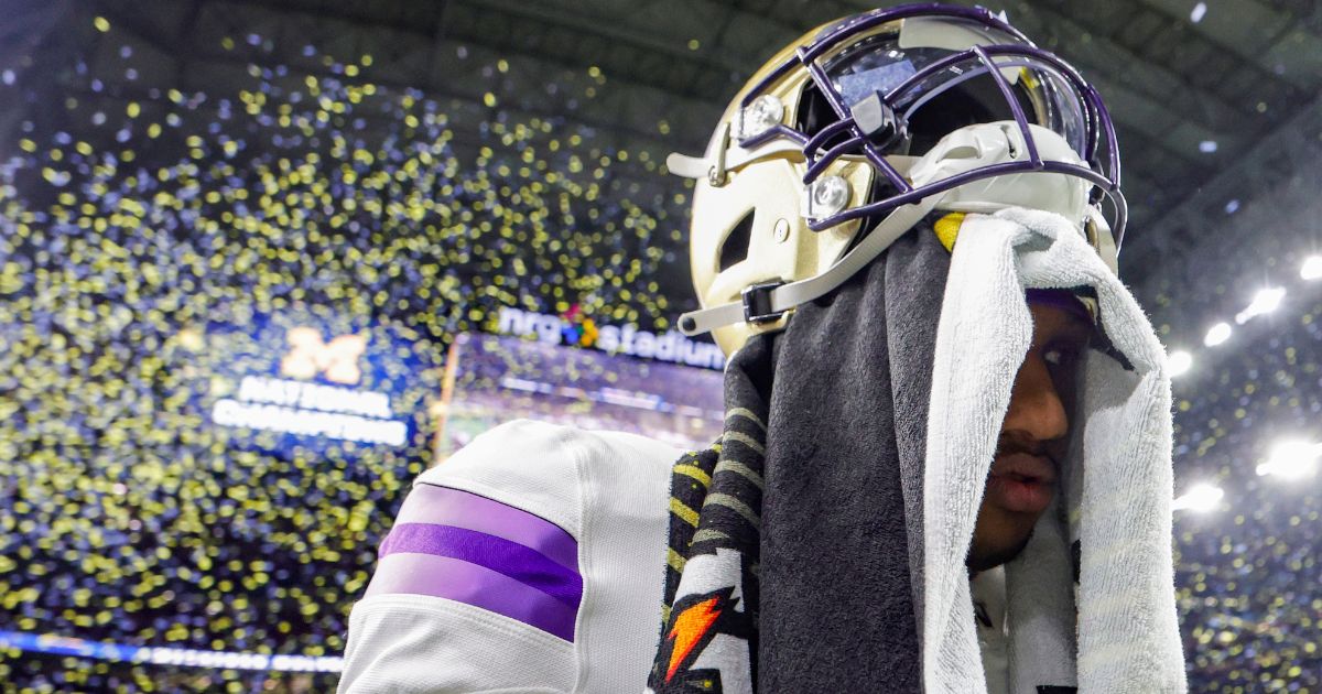 Washington Huskies quarterback Michael Penix Jr. walks off the field after being defeated by the Michigan Wolverines in the CFP National Championship Game in Houston, Texas, on Monday.