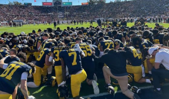 Before their Rose Bowl match-up against the Alabama Crimson Tide on Monday, the Michigan Wolverines took to the field for a team prayer. Michigan won the game, securing a spot in the College Football National Championship.