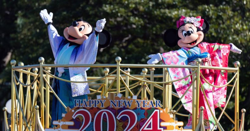 Actors dressed as Walt Disney characters Mickey Mouse (L) and Minnie Mouse (R) perform during the Tokyo Disneyland New Year Parade 2024 at Tokyo Disneyland on Monday.