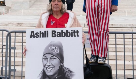 Micki Witthoeft, mother of Ashli Babbitt, the woman fatally shot by police inside the U.S. Capitol on Jan. 6, 2021, joins protesters outside of the Supreme Court in Washington, Jan. 6, 2023.