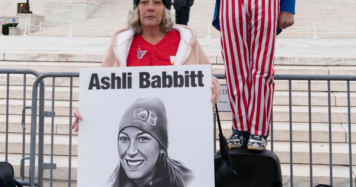 Micki Witthoeft, mother of Ashli Babbitt, the woman fatally shot by police inside the U.S. Capitol on Jan. 6, 2021, joins protesters outside of the Supreme Court in Washington, Jan. 6, 2023.