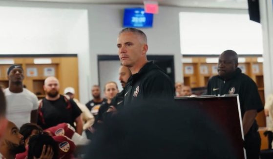 FSU football coach Mike Norvell talks to his players after their 63-3 Orange Bowl defeat.