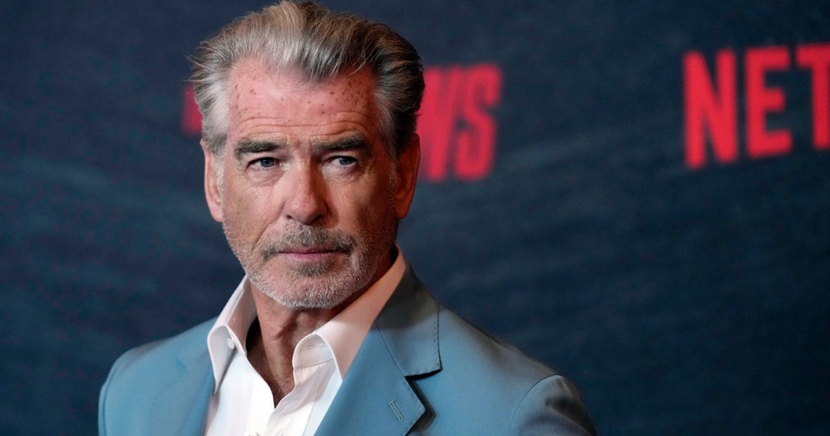 Actor Pierce Brosnan poses at a special screening of the film "The Out-Laws," June 26, at the Regal LA Live theaters in Los Angeles.