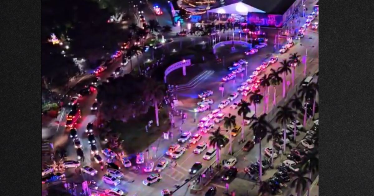 Dozens of police cars converged on the Bayside Marketplace, an outdoor shopping mall in Miami.