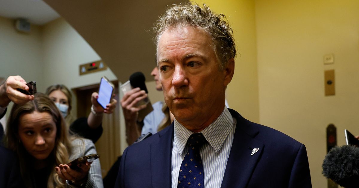 Republican Sen. Rand Paul of Kentucky speaks to reporters as he walks through the Senate Subway at the U.S. Capitol Building in Washington on Sept. 28.
