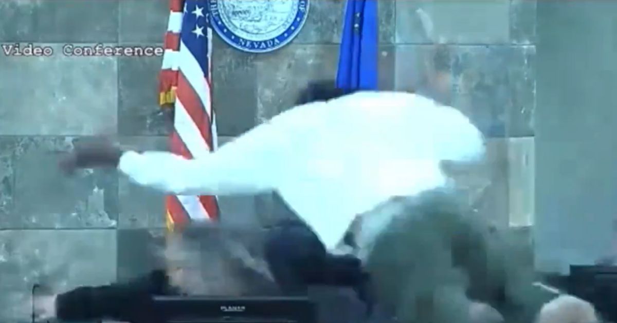 Deobra Redden leaps across the bench to attack the judge.