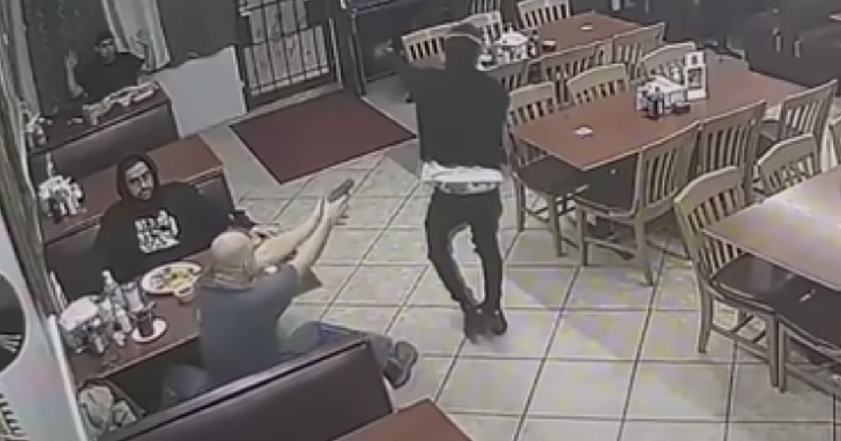 After the robber went past his table, a customer pulled out a weapon and shot him several times.
