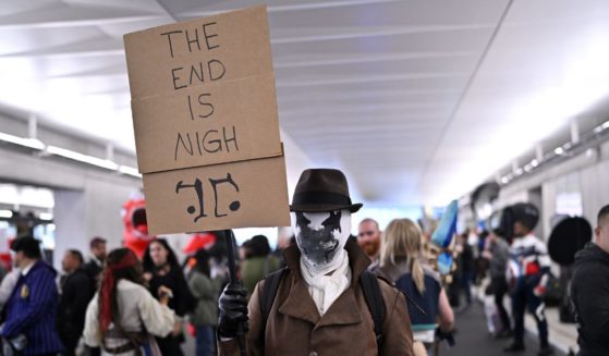 A cosplayer poses as Rorschach from Watchmen during New York Comic Con 2023 - Day 3 at Javits Center on October 14, 2023 in New York City.
