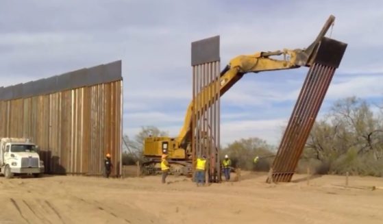 Texas Gov. Greg Abbott posted a video on Tuesday showing off the border wall he was erecting to defend the Texas-Mexico border.