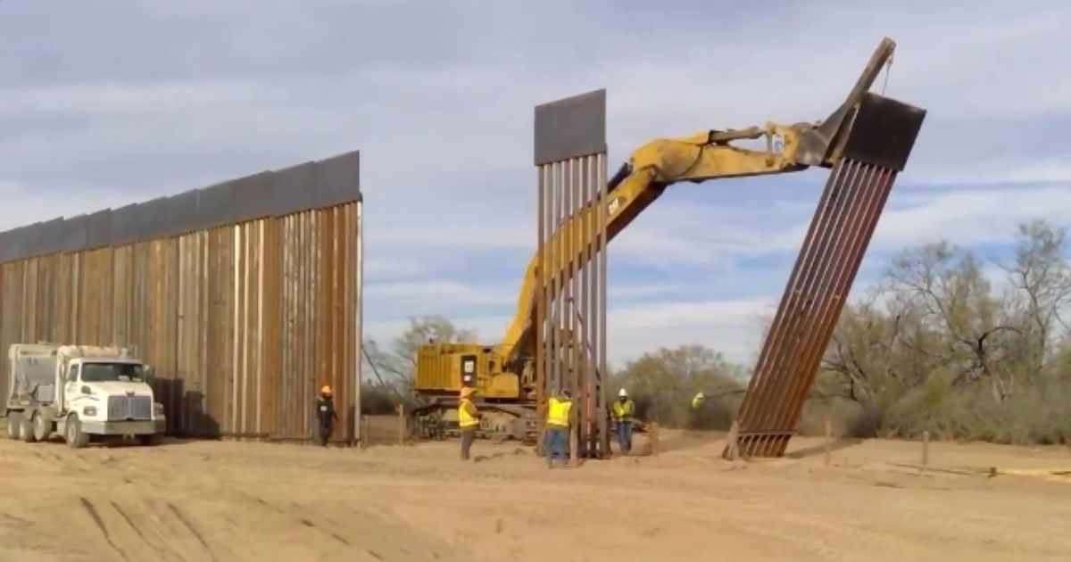 Texas Gov. Greg Abbott posted a video on Tuesday showing off the border wall he was erecting to defend the Texas-Mexico border.