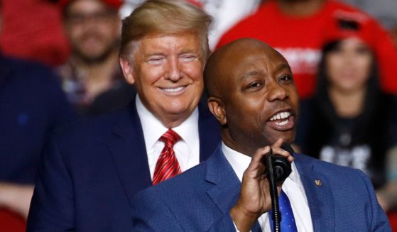 Sen. Tim Scott, R-S.C., speaks in front of President Donald Trump during a campaign rally, Feb. 28, 2020, in North Charleston, South Carolina.
