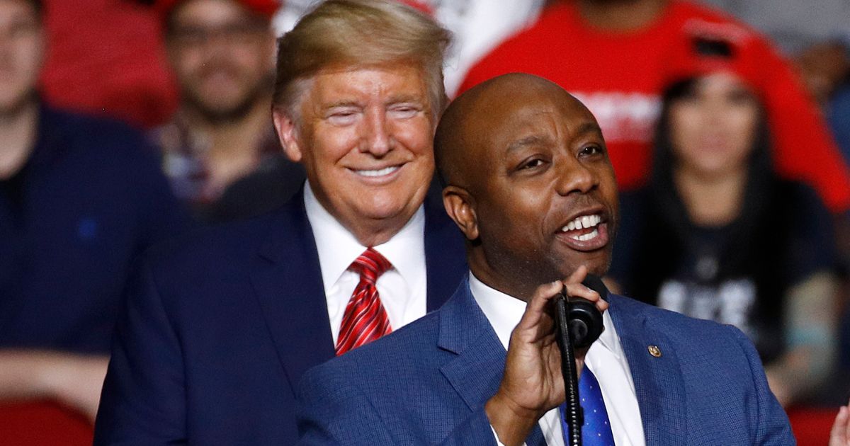 Sen. Tim Scott, R-S.C., speaks in front of President Donald Trump during a campaign rally, Feb. 28, 2020, in North Charleston, South Carolina.