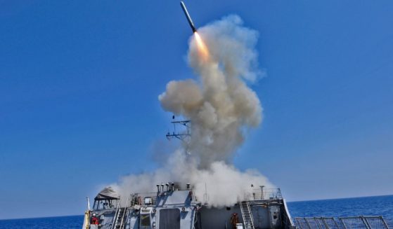 The guided missile destroyer USS Barry launches a Tomahawk cruise missile from the Mediterranean Sea in support of Operation Odyssey Dawn.