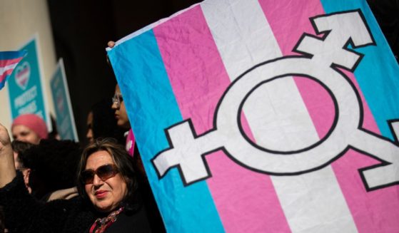 Activists rally in support of transgender people on the steps of New York City Hall.
