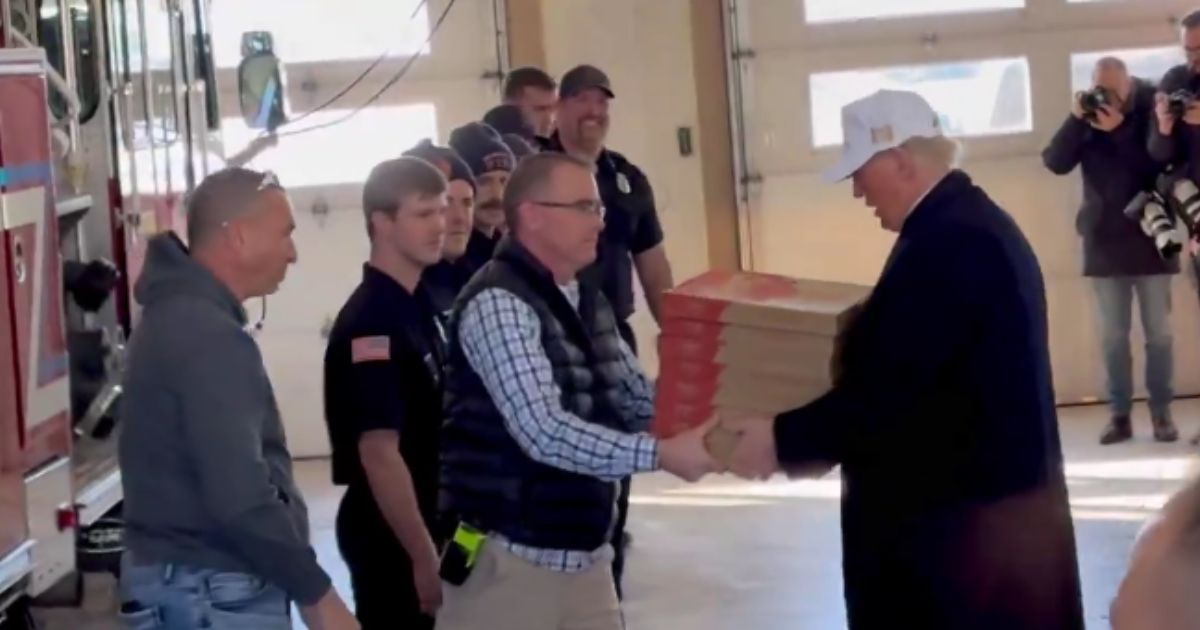 Former President Donald Trump delivered pizza to firefighters at the Waukee Fire Department in Waukee, Iowa, on Sunday.