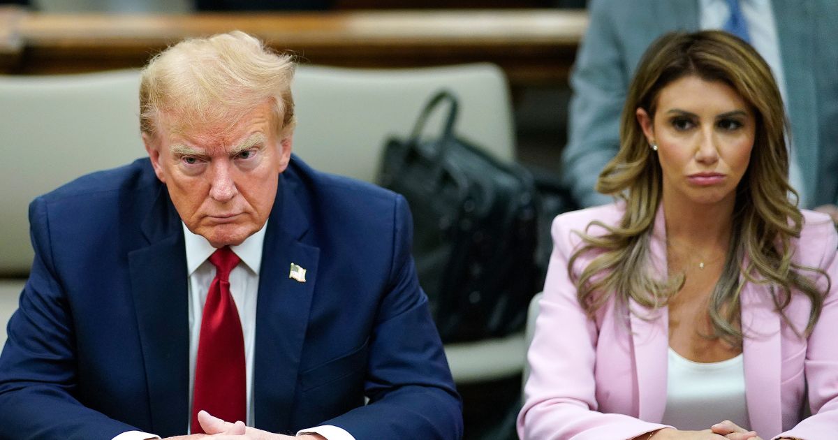 Former President Donald Trump, left, and his attorney Alina Habba, right, sit at the defense table in the New York State Supreme Court in New York City on Dec. 7.