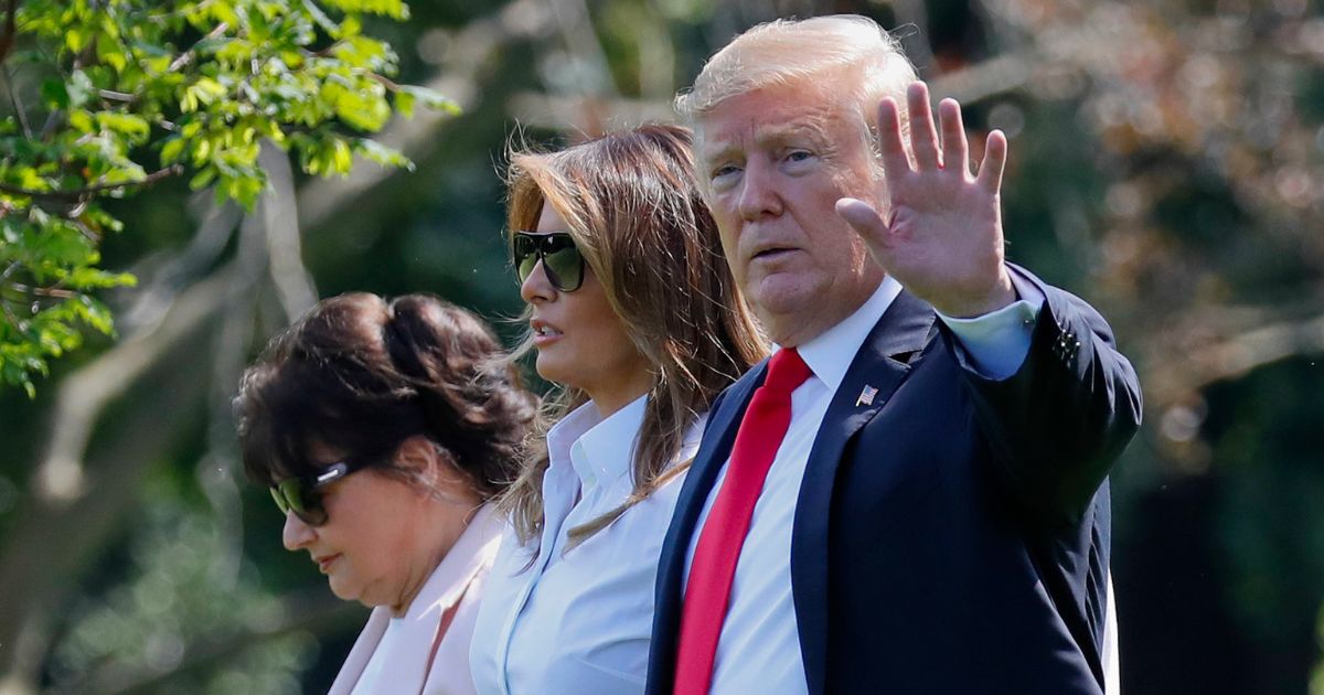 Then-President Donald Trump waves as he walks across the South Lawn of the White House in Washington with wife Melania Trump and her mother, Amalija Knavs, on June 29, 2018.