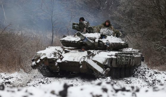 Ukrainian soldiers rive a tank in a position near to the town of Bakhmut, Ukraine, amid the Russian invasion of Ukraine on Dec. 13.