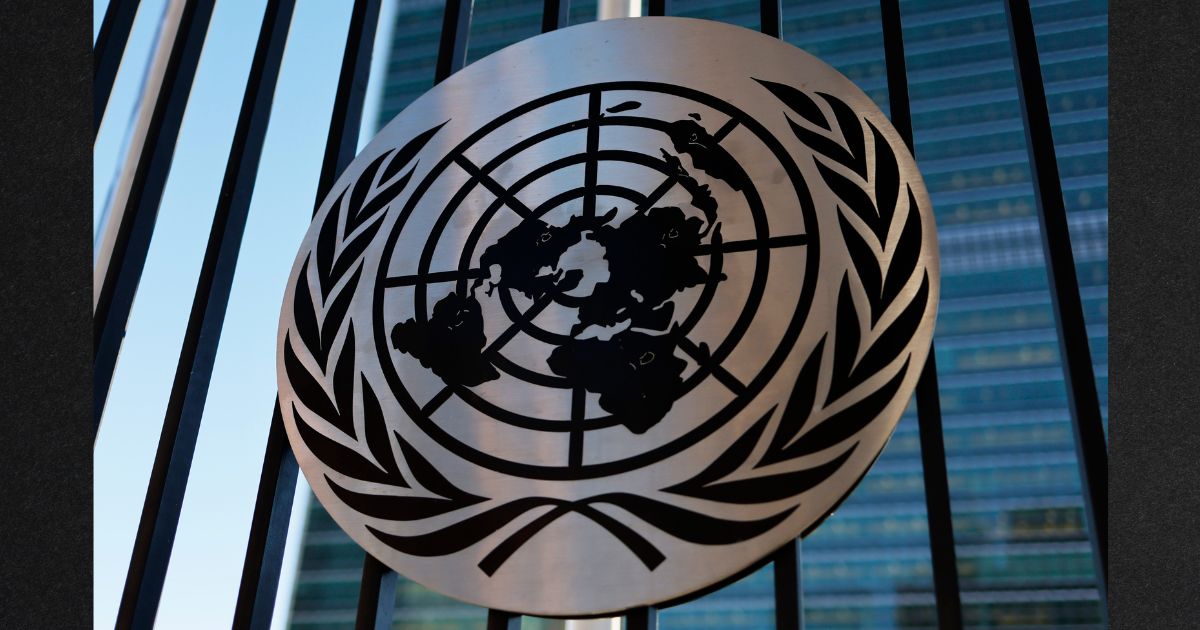 The United Nations logo is seen on a fence at the United Nations headquarters in New York City on Dec. 12.