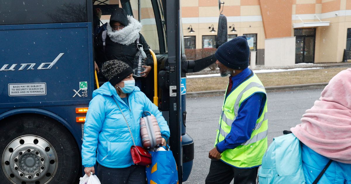 Refugees arrive at the Plattsburgh, New York, bus station before heading to the Roxham border crossing into Canada, on March 25, 2023.