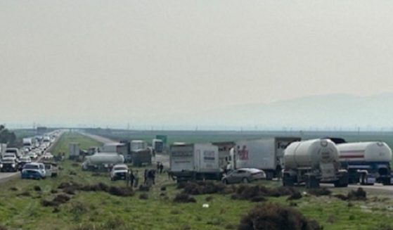 Traffic backs up at the site of a pilelip Saturday morning on Interstate 5 in Southern California.
