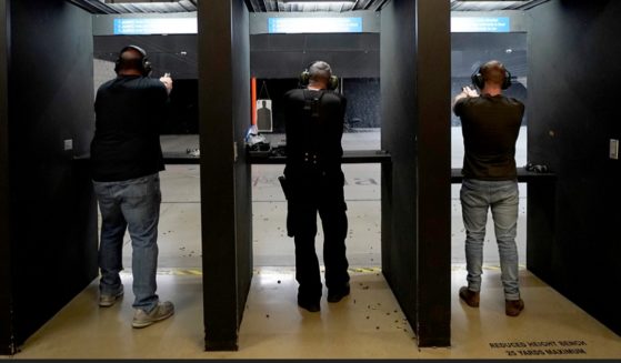 Gun users fire weapons at a Roseville, California, shooting range in a 2022 file photo.