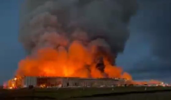 Fire engulfs buildings at a chicken farm in Kurten, Texas, on Jan. 29.