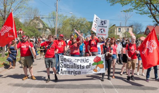 The Democratic Socialists of America march during the annual May Day parade in Minneapolis on May 6, 2018. The party is in dire financial straits after its public support for the Hamas terrorist group.