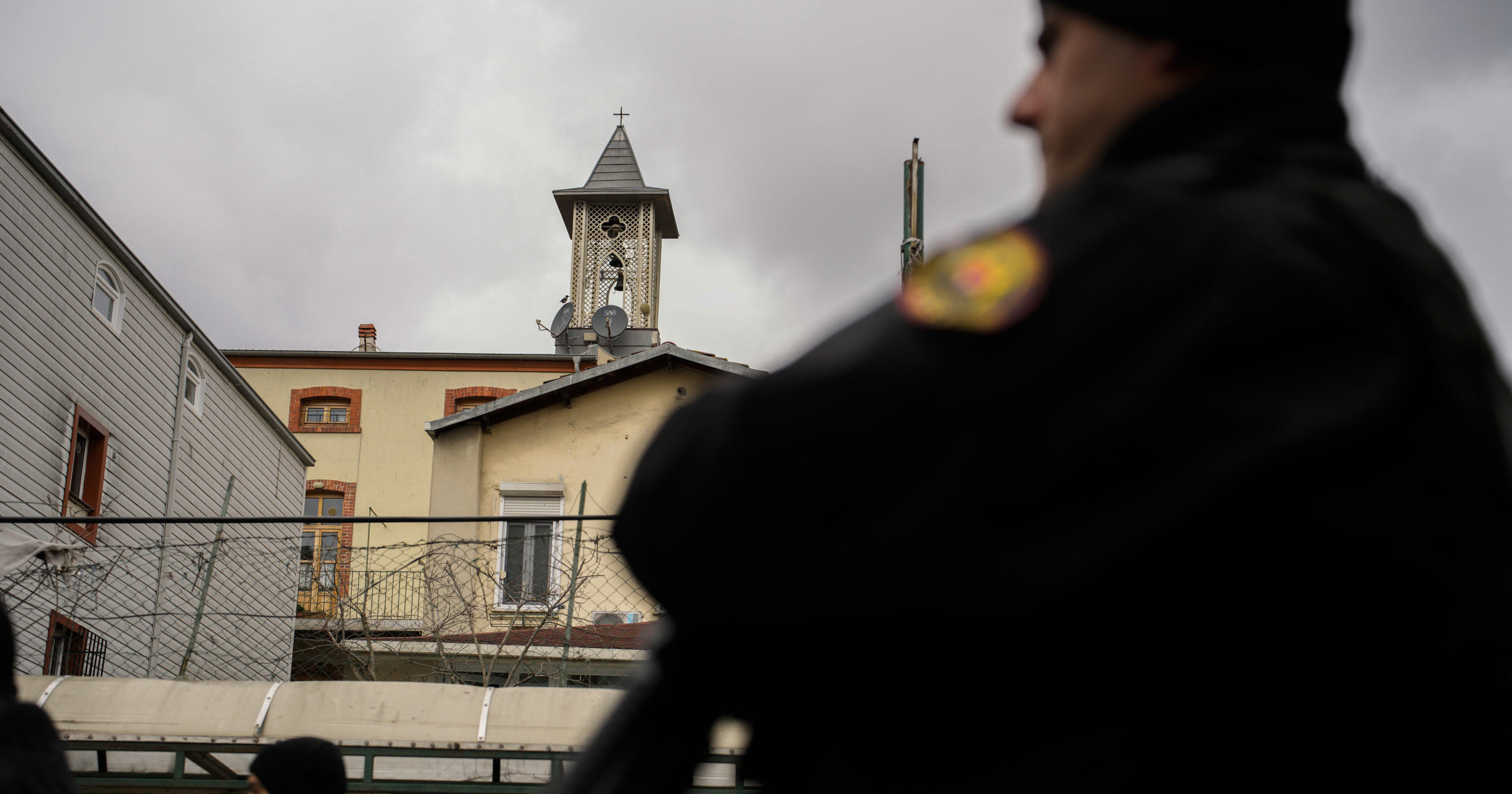 Turkish police officers stand guard in a cordoned-off area outside the Santa Maria church in Istanbul on Sunday.