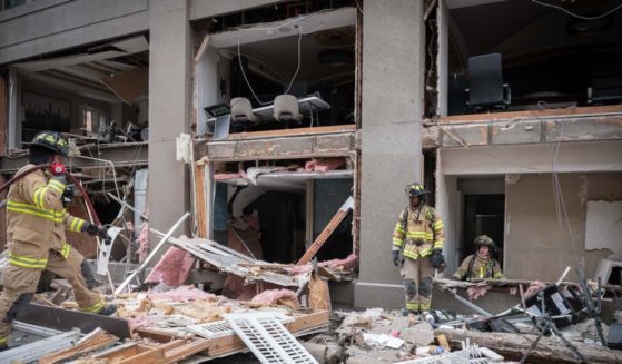 Firefighters in Fort Worth, Texas, work the scene of an explosion at the Sandman Signature Hotel downtown on Monday.