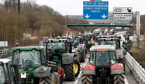 French farmers stop their tractors on the A16 motorway on Tuesday as they maintain roadblocks on key highways into Paris for a second day, increasing pressure on the government for more concessions on pay, tax and regulations. Farmers protests across Europe are growing as they demand better conditions to grow produce.