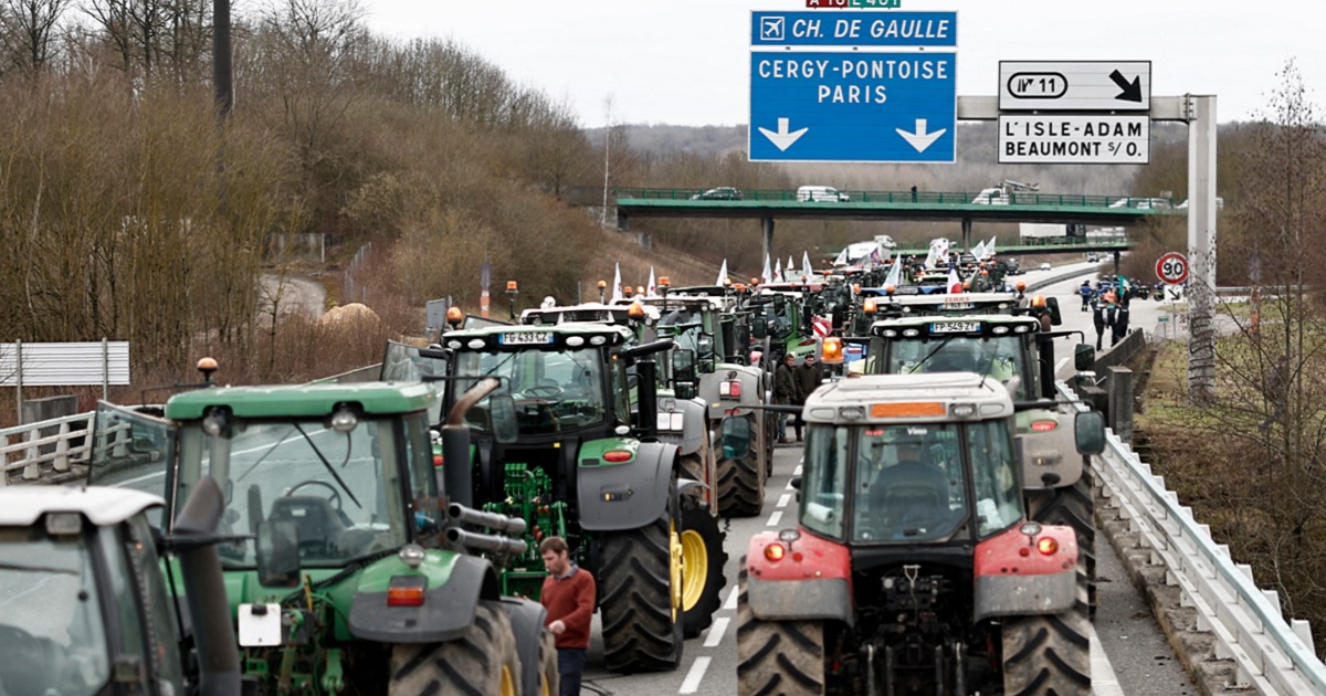 French farmers stop their tractors on the A16 motorway on Tuesday as they maintain roadblocks on key highways into Paris for a second day, increasing pressure on the government for more concessions on pay, tax and regulations. Farmers protests across Europe are growing as they demand better conditions to grow produce.