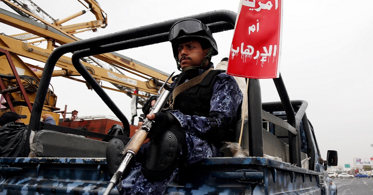 A Yemeni security soldier loyal to the Houthi movement guards a truck during a protest held to condemn the U.S. for redesignating Houthis as a global terrorist group, and against the U.S.-British aerial attacks conducted on Yemen on Friday in Sana'a, Yemen.