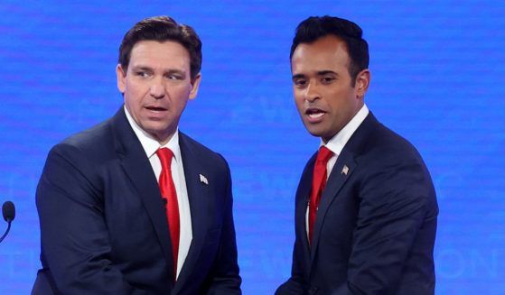 Republican presidential candidates Florida Gov. Ron DeSantis (L) and Vivek Ramaswamy shake hands at the conclusion of the NewsNation Republican Presidential Primary Debate at the University of Alabama Moody Music Hall on December 6, 2023 in Tuscaloosa, Alabama.