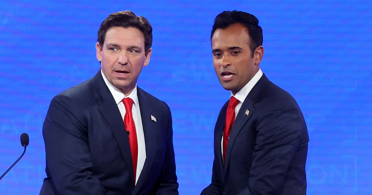 Republican presidential candidates Florida Gov. Ron DeSantis (L) and Vivek Ramaswamy shake hands at the conclusion of the NewsNation Republican Presidential Primary Debate at the University of Alabama Moody Music Hall on December 6, 2023 in Tuscaloosa, Alabama.