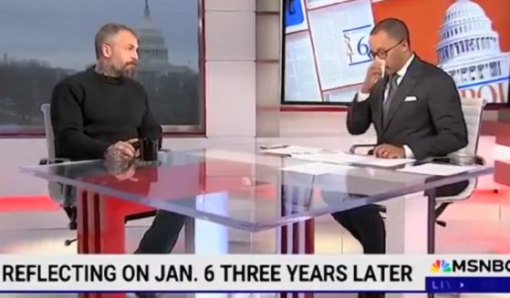 MSNBC's Jonathan Capeheart, host of "The Saturday Show with Jonathan Capeheart," breaks down while interviewing former Washington, D.C., Metropolitan Police Officer Michael Fanone on Saturday, the third anniversary of the Jan. 6, 2021, Capitol insurrection.