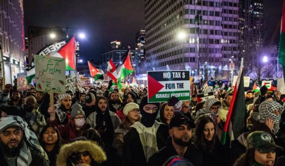 Pro-Palestinian demonstrators march in Boston, Massachusetts on December 31, 2023.