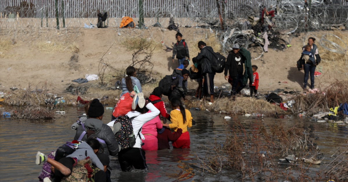 Migrants cross the Rio Grande into the United States from Juarez, Mexico, on Tuesday.