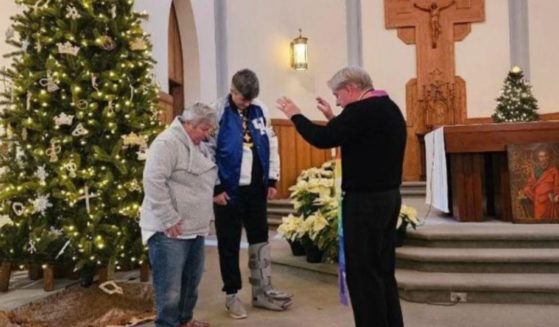 This Twitter screen shot shows a same-sex couple being 'blessed' at a church in Kentucky.